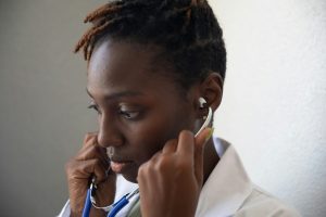 A physician assistant use stethoscope to assist with patient assessment